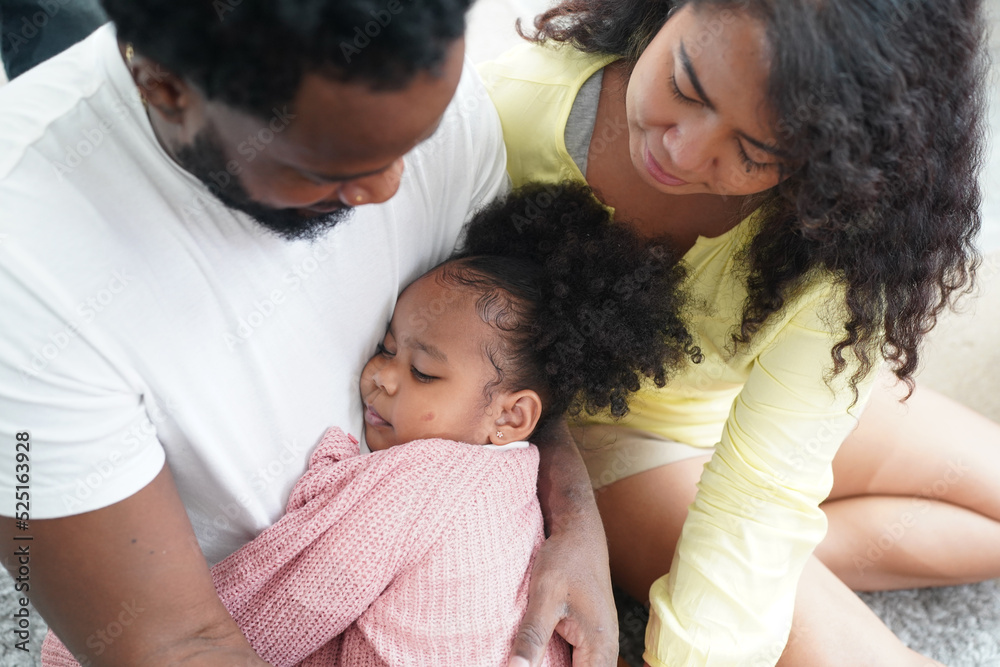 Shot of happy interracial family of mother father and their daughter inside modern apartment. Shot of happy interracial family of mother father and their daughter inside modern apartment.