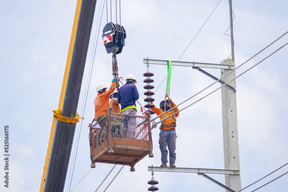 custom made wallpaper toronto digitalAn electrician climbs a cable car and a light pole with safety devices to install a new electrical system.
