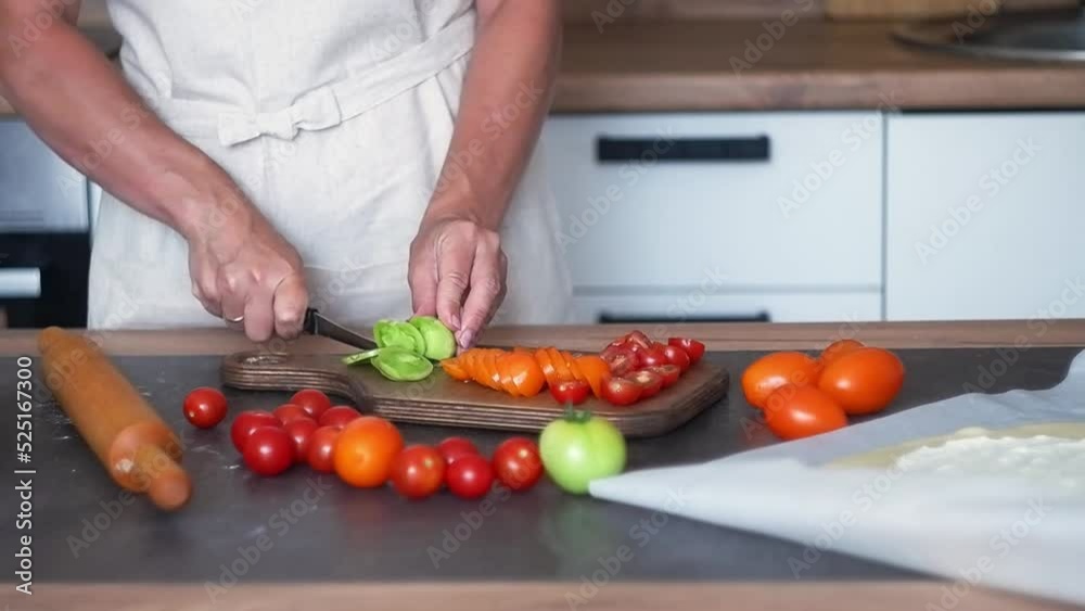 person cutting vegetables on the wooden in light kitchen person cutting vegetables on the wooden in light kitchen