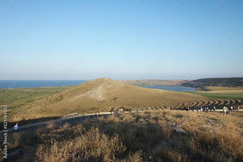 landscape with people silhouettes enisala tulcea romania hill