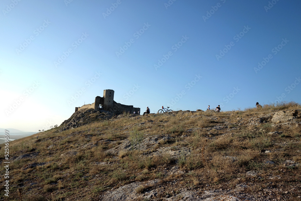 man and bicycle near a forstress castle enisala tulcea romania man and bicycle near a forstress castle enisala tulcea romania