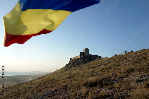 enisala stronghold and romanian flag in the wind