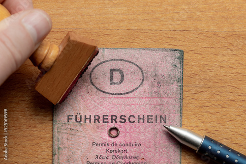 Oldenburg, Germany, August 22 2022, old used, dirty pink German driving license © SLindenau