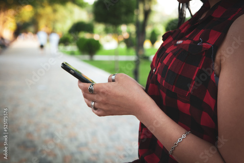 a young girl holding a phone in her hands