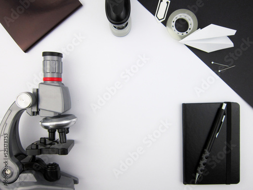      Creative trendy minimalist school or office workspace with black materials on a white background.                   photo