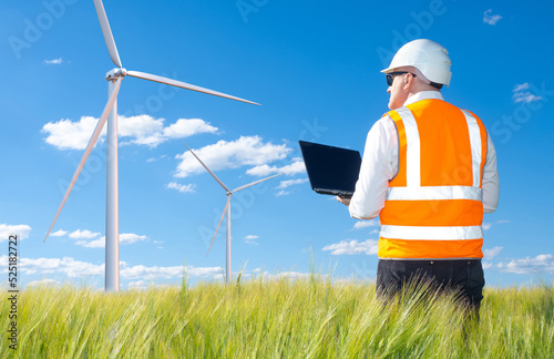 Wind mills in field. Male e...