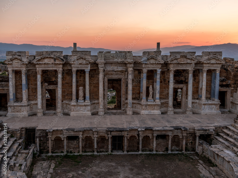 Obraz premium Amphitheater in the ancient city of Hierapolis in the afternoon. Unesco Cultural Heritage Monument. Pamukkale, Turkey 15.07.2022