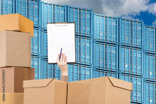 Hand among boxes. Warehouse...