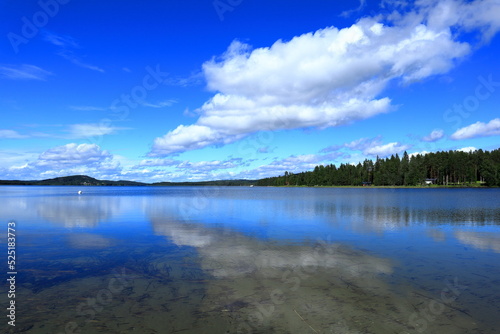 Cloud reflection in a calm sea. Summer day. Jämtland, Sweden, Scandinavia, Europe, 2022.