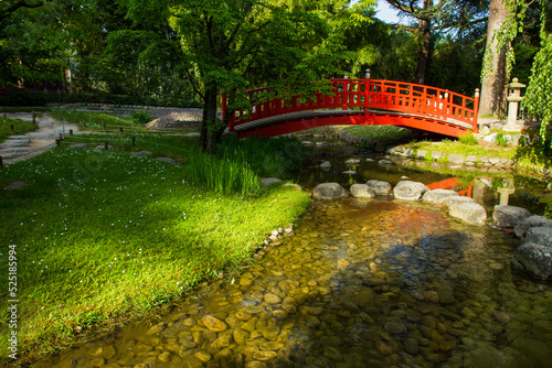 Red japanese bridge in japanese garden of Albert Kahn Museum