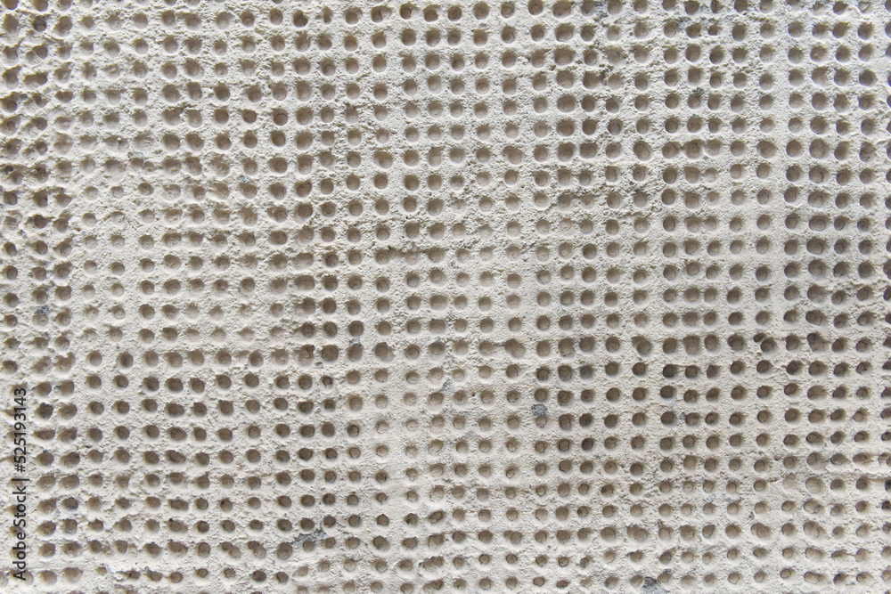 Rough surface texture of sand screed cement wall with big holes and uneven stains. Dirty grey concrete wall as background close view Rough surface texture of sand screed cement wall with big holes and uneven stains. Dirty grey concrete wall as background close view