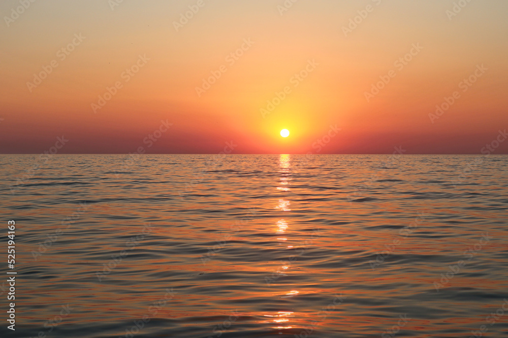 Picturesque orange sunset on the sea coast of Italy, Calabria