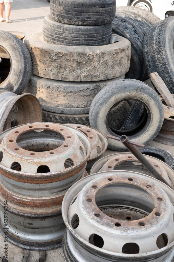 old wheels and tires on the street dump car repair shop