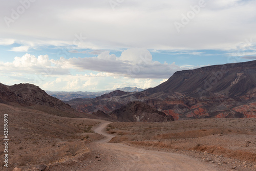 Overcast view of Kingman Wash trail dirt road leading to Fortification Hill ancient volcano within Lake Mead recreation area August 2022