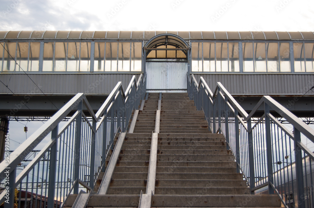 Covered railroad crossing for passengers with stairs Covered railroad crossing for passengers with stairs