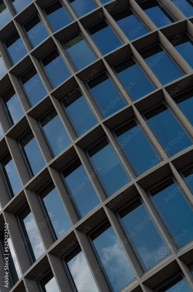 Abstract modern building background for design, office building facade with large glass windows Abstract modern building background for design, office building facade with large glass windows
