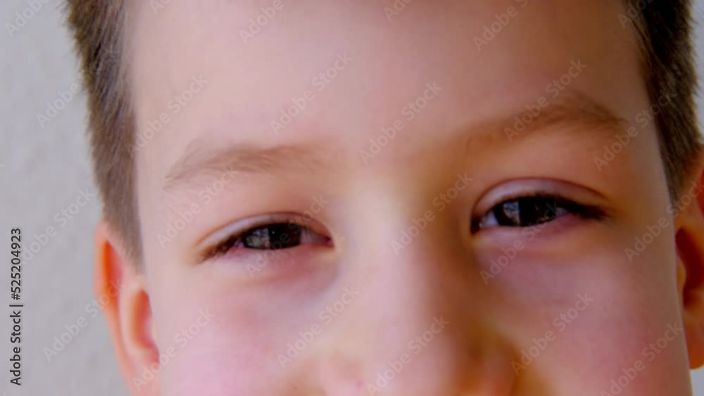 close-up of part of the child's face, boy 8-10 years old Asian-European appearance, human eye looking fun at the camera, the concept of surveillance, peeping, tracking close-up of part of the child's face, boy 8-10 years old Asian-European appearance, human eye looking fun at the camera, the concept of surveillance, peeping, tracking