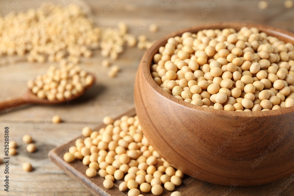 Natural soy beans on wooden table, closeup. Space for text Natural soy beans on wooden table, closeup. Space for text