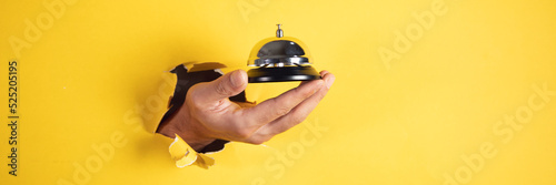 male traveler hand bell to call