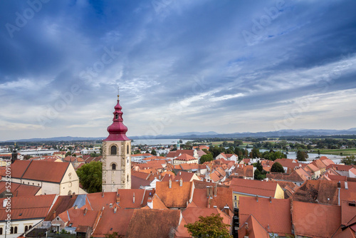 Panorama of the city of Ptuj, in Styria, in Slovenia, seen from the old town and the fortress castle, with the Ptujsko jezero lake in background. It is a typical Central European village. ....