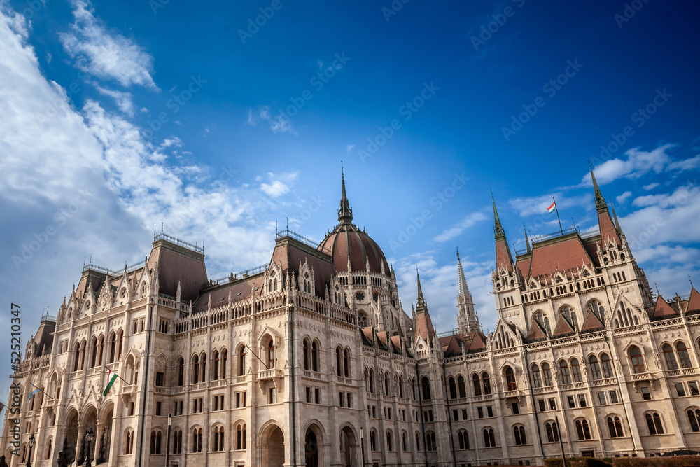 Hungarian Parliament (Orszaghaz) in Budapest, capital city of Hungary, taken during a sunny afternoon. The Parliament, of a gothic style, is an iconic landmark of the city.....