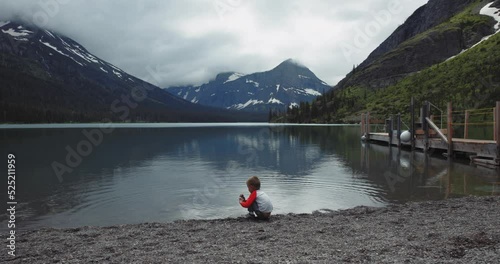Young boy playing in water on National Park hike photo