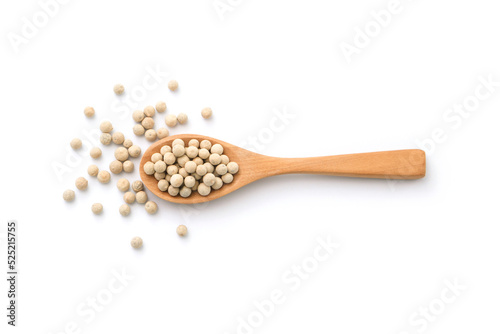 White pepper or peppercorns in wooden spoon isolated on white background , top view , flat lay.