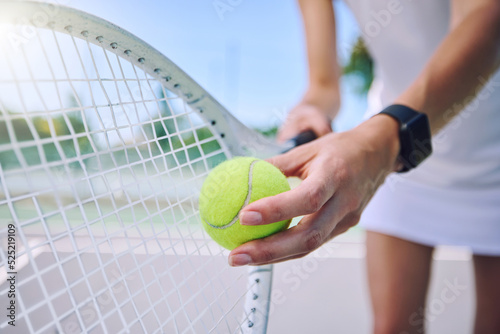 Closeup tennis ball, racket and sport for fit, active and healthy player training and exercising for practice. Professional player getting ready to serve for routine court workout and exercise match © Michael C/peopleimages.com