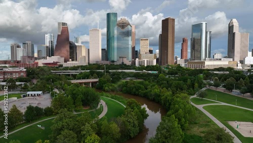 Aerial view of skyscrapers in Downtown Houston and the Eleanor Tinsley Park on a summer day in USA - rising, drone shot photo