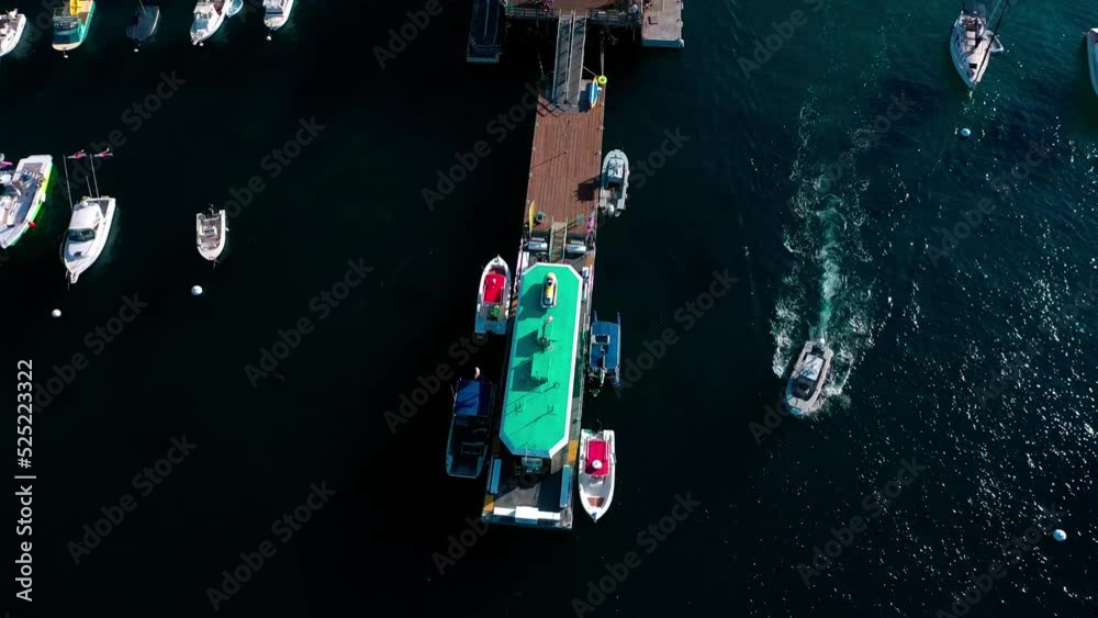 Drone view of the Catalina Pier panning up to view the beaches, shops, and houses of Avalon. Drone view of the Catalina Pier panning up to view the beaches, shops, and houses of Avalon.