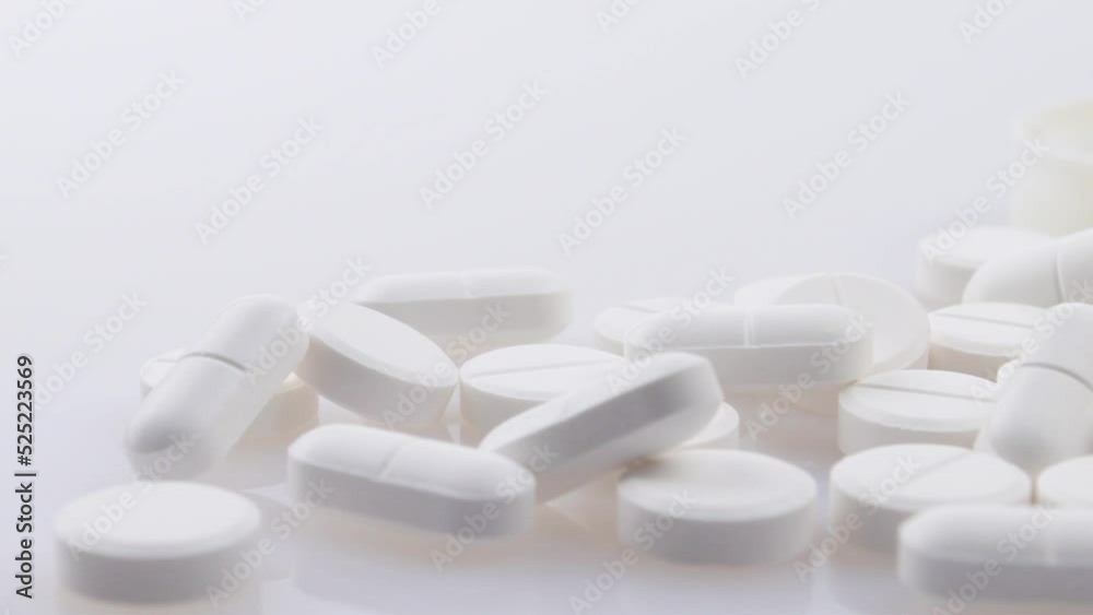 4k panning footage from generic pharmaceutical pain drugs to orange prescription pill bottle of opioids concept for opioid epidemic, painkiller medicine addiction, addictive medication and drug abuse