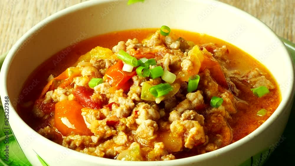Close up Nam Prik Ong (Spicy Northern Thai Pork and Tomato) in bowl , Thai famous northern food. Close up Nam Prik Ong (Spicy Northern Thai Pork and Tomato) in bowl , Thai famous northern food.