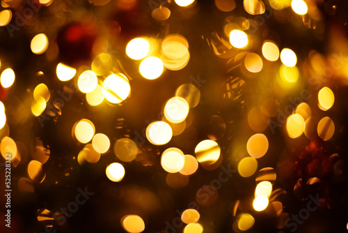 Close-up festive christmas tree lights blurred background.
