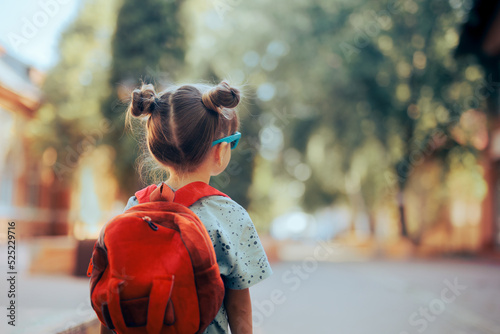 Portrait of a Little Girl Going Back to School . Child wearing a backpack ready for the first day of kindergarten

 photo