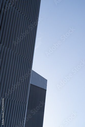 Corner of a modern steel building with geometric surface © JUN LI