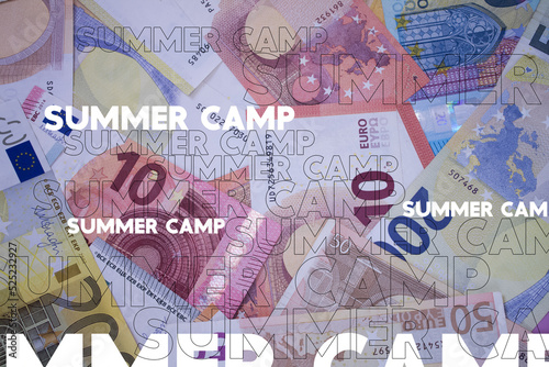 Summer Camp word with money. Paper currency background with different banknotes. photo