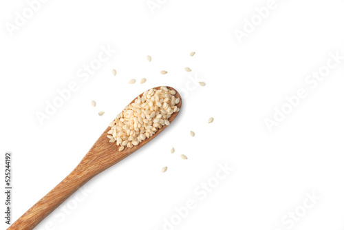 Top view of white sesame seeds in a wooden .spoon