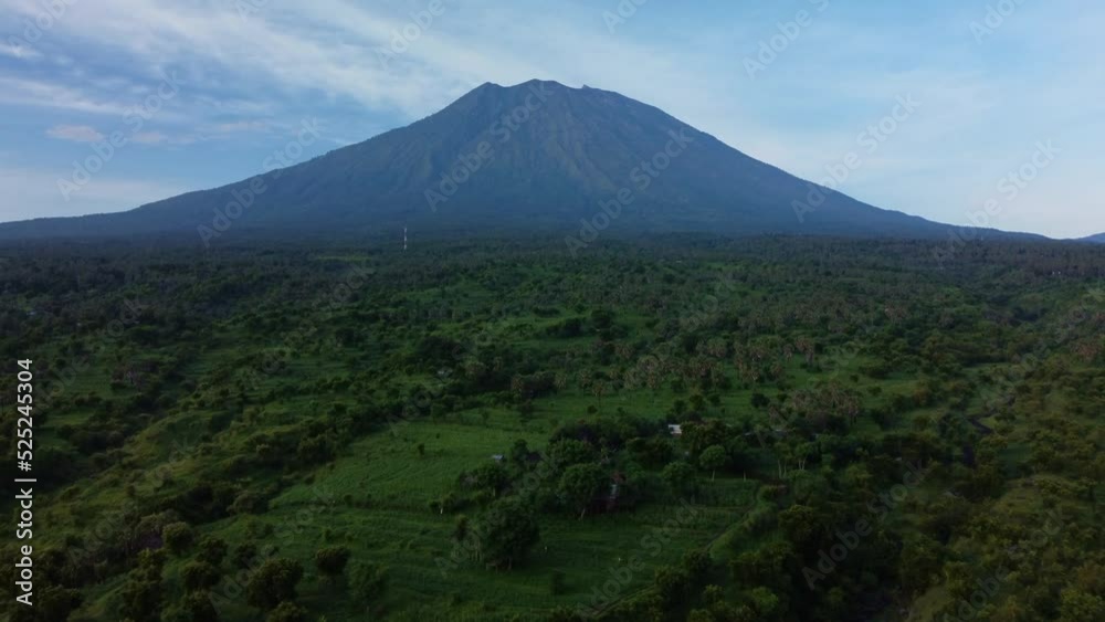 Mount Agung vulcano with green nature, Aerial push forward tilt up Mount Agung vulcano with green nature, Aerial push forward tilt up