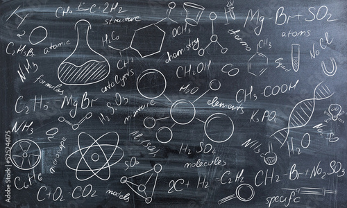 Background of a school board with scribbles painted chalk. A traditional image of chemistry. photo