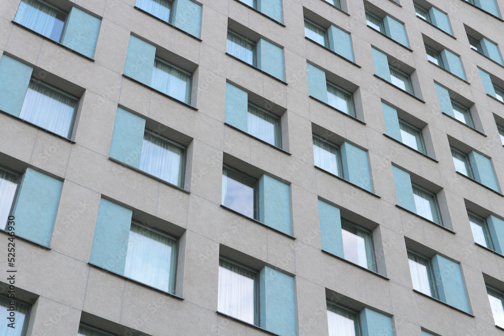 Windows of an apartment building or office building. Urban background.