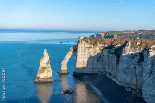 West coast of France. Clifs of Etreta. Rocks on the coast of the English channel strait. Etretat village, Normandy region.