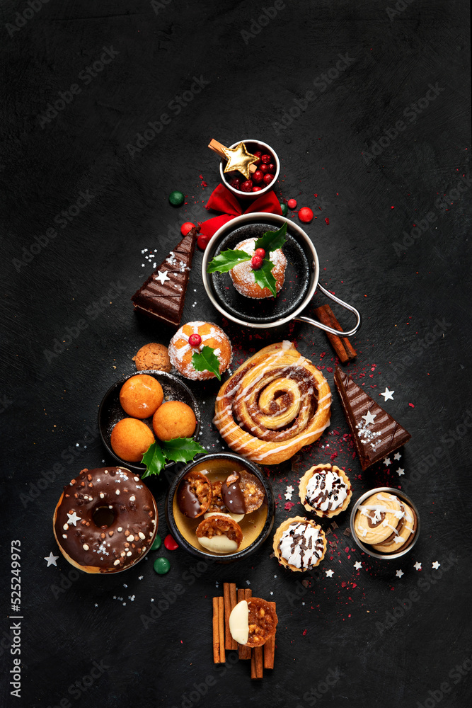 Christmas tree with sweets and cookies decoration on dark background. Christmas tree with sweets and cookies decoration on dark background.