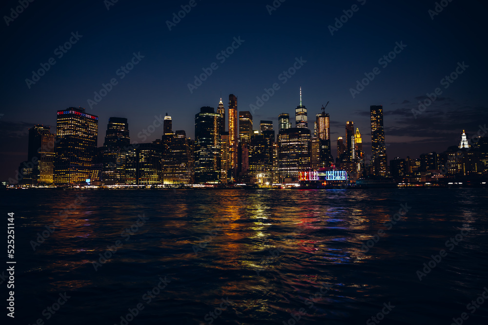 Panoramic view on Manhattan at night, New York, USA. Midtown Manhattan skyline panorama at night. West cityscape from across Hudson River, New York City, NY, USA