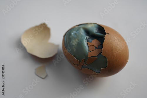 Fotografie Rotten egg or Broken egg,worm,germs,,crack and dirty isolated on white background