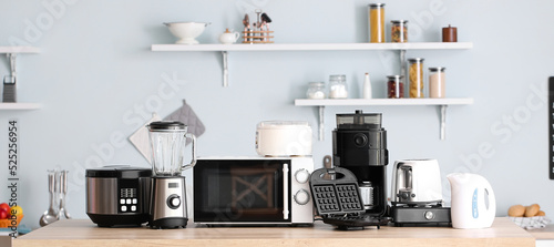 Different household appliances in kitchen photo