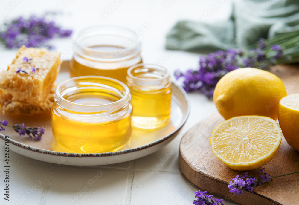 Jar with honey and fresh lavender flowers Jar with honey and fresh lavender flowers