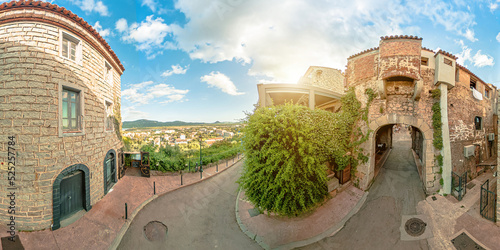 Aerial view of Porto Vecchio city roads at sunset on Corsica island of France. Drone view of downtown skyline with tourists in restaurants and shops and the port. 360 degrees VR panorama. photo