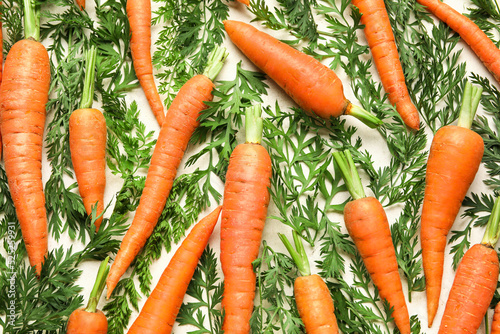 Fresh carrots and leaves on...