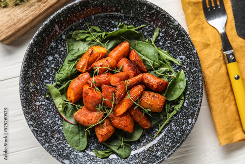 Plate of tasty baked carrot...