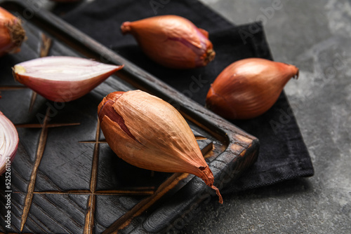 Wooden board with fresh oni...